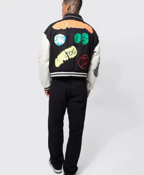 black boxy fit graffiti varsity jacket back side.webp