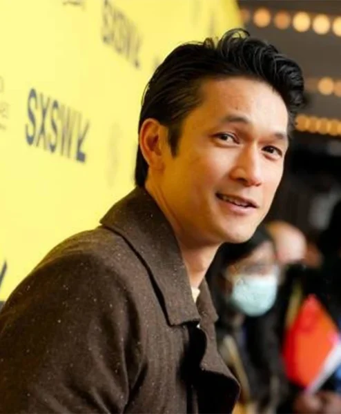 Everything Everywhere All at Once Harry Shum Jr Brown Coat closeup.webp