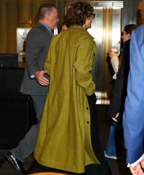 Late Night with Seth Meyers Connor Storrie Mustard Green Wool Coat Back.webp
