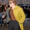Late Night with Seth Meyers Connor Storrie Mustard Green Wool Coat Closeup.webp