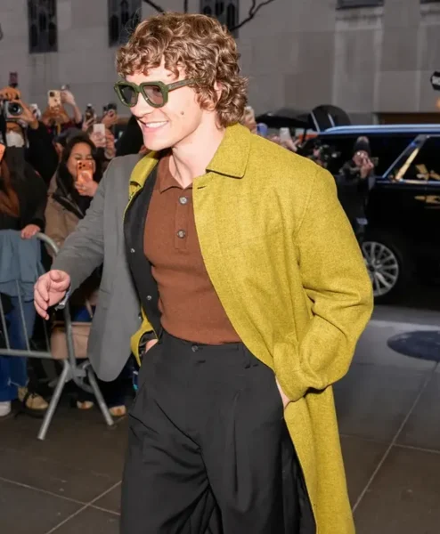 Late Night with Seth Meyers Connor Storrie Mustard Green Wool Coat Closeup.webp