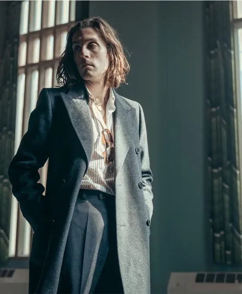 Rain Dogs 2023 Jack Farthing Black Coat right.webp