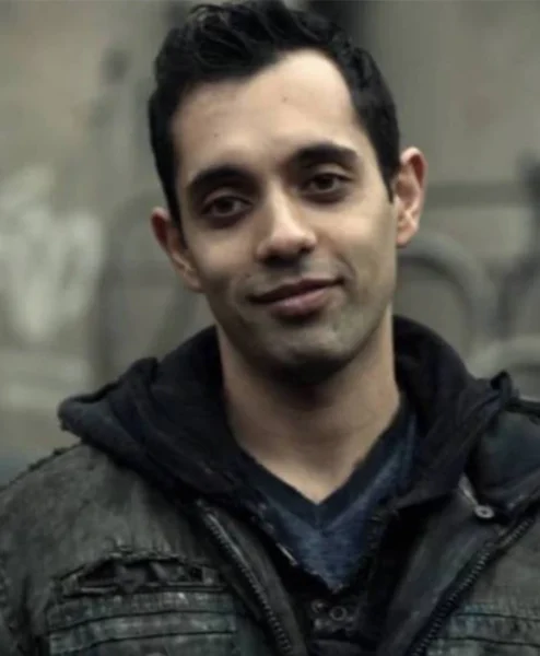 Sachin Sahel The 100 Dr. Eric Jackson Black Coat left.webp