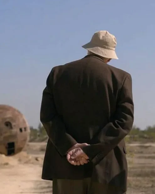 Tales From The Loop Russ Brown Coat Back.webp