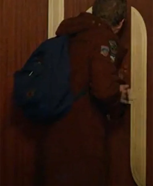 The Portable Door 2023 Patrick Gibson Brown Coat back.webp