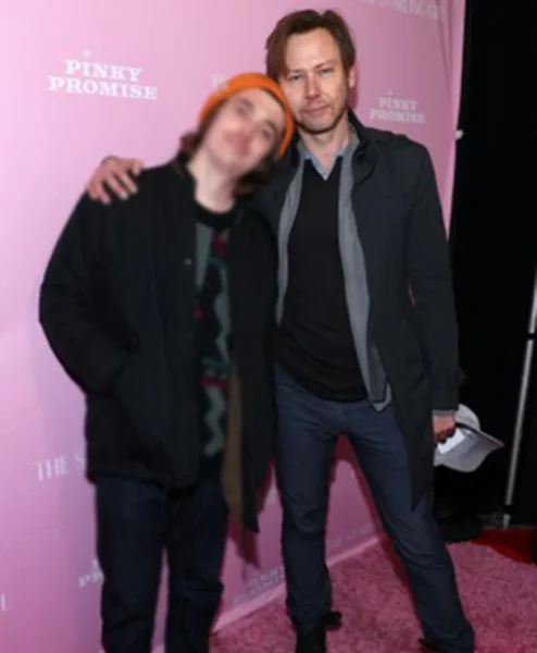 The Starling Girl 2023 Jimmi Simpson Black Coat left.webp